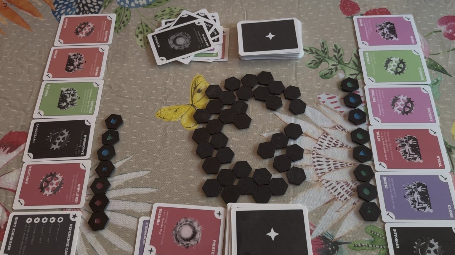 Meteor Mayhem cards and resource pieces arranged during a playtest